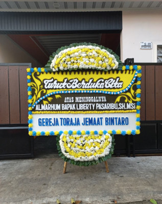 Papan Bunga Duka di Wanutengah